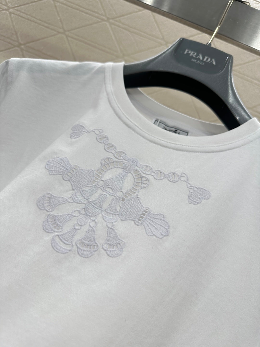 26NEW Hollow-out Embroidered Logo T-shirt