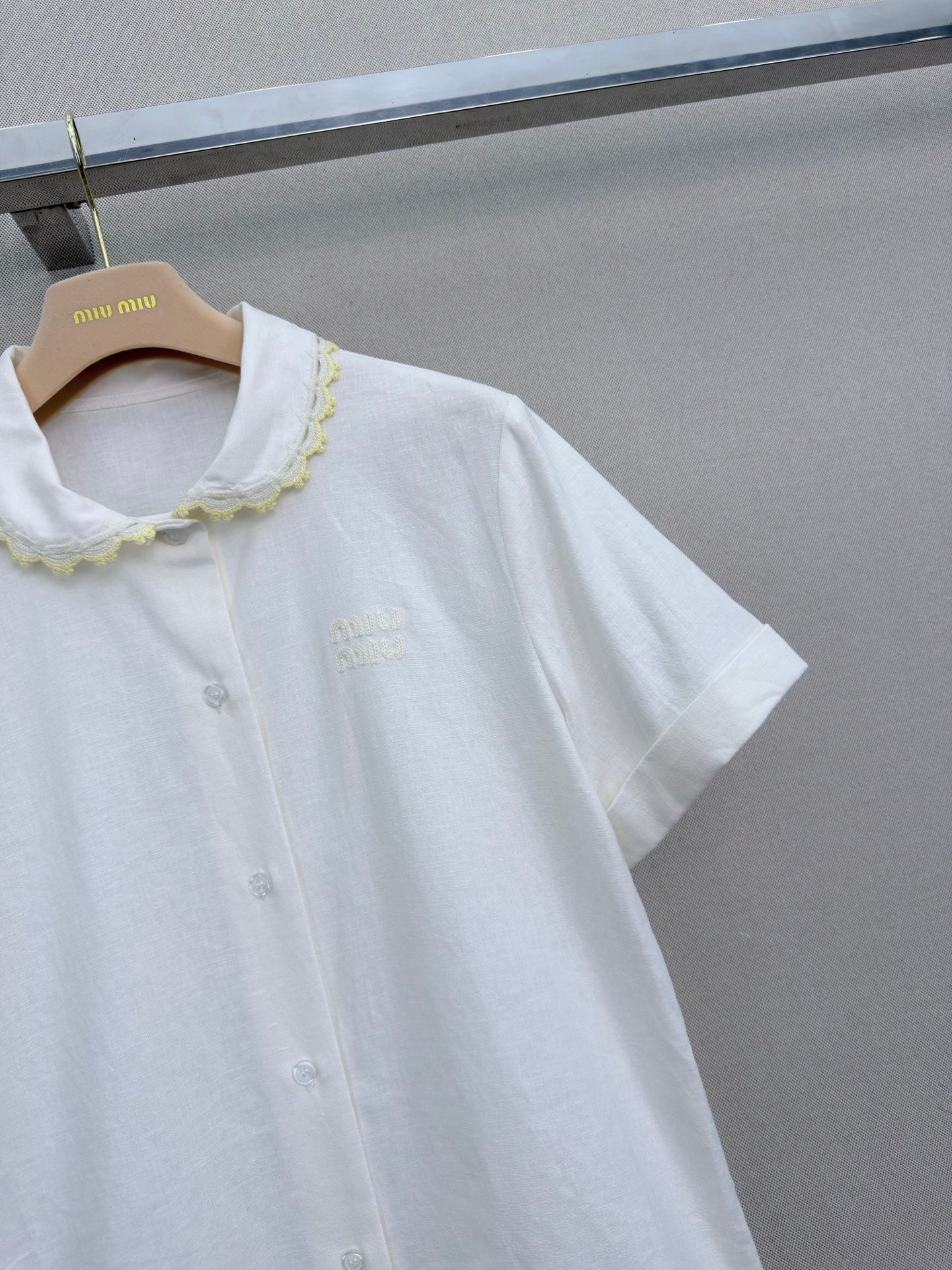 Lace-trimmed short white shirt