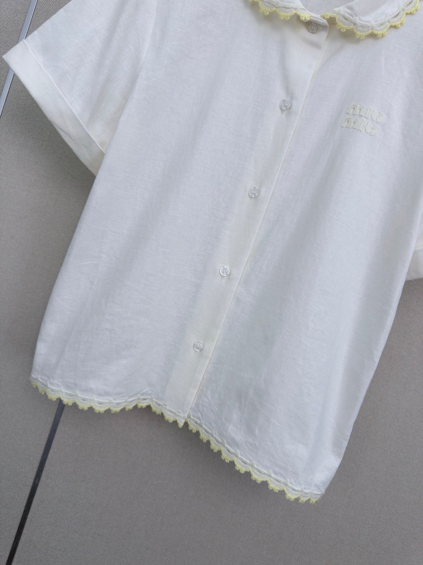 Lace-trimmed short white shirt