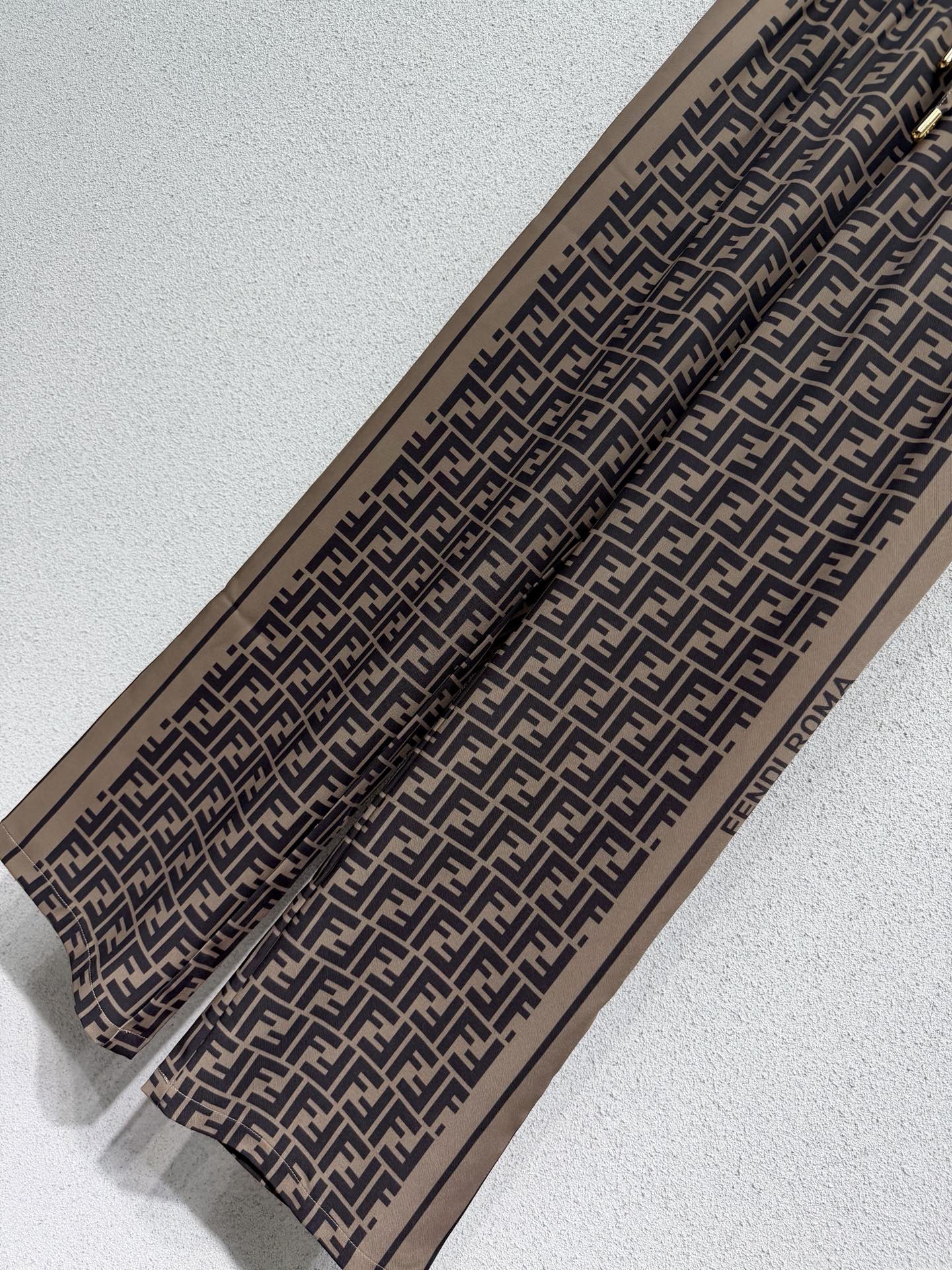 Brown elastic waist monogram trousers
