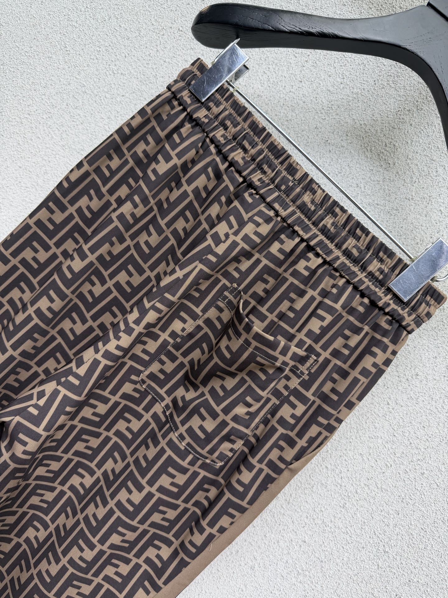 Brown elastic waist monogram trousers